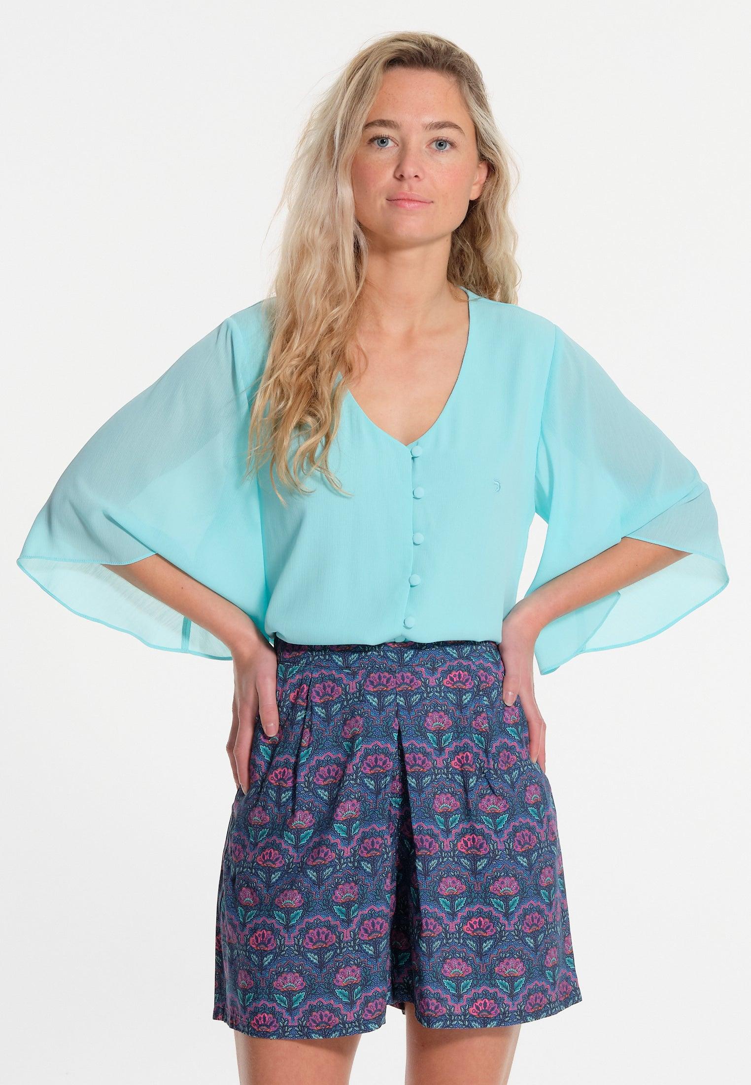 Chemisier vert avec manches larges